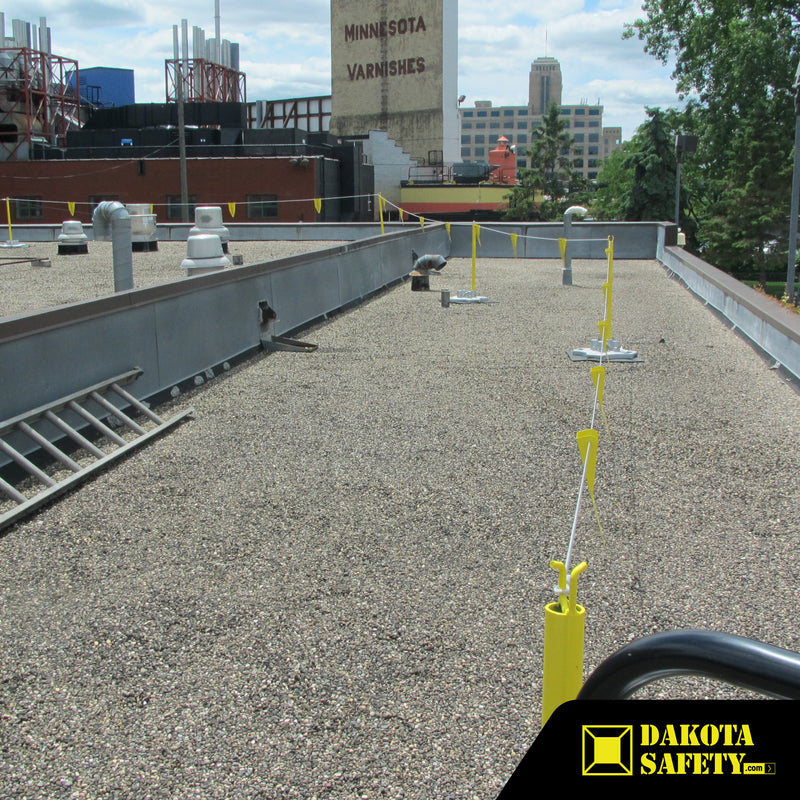 Perma-Line Permanent Visual Warning Line System with metal flagging and galvanized ballasted bases