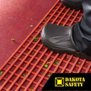 Herongripa open grid matting demonstrating food debris drainage capability in commercial kitchen environment