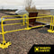 SafetyRail 2000 OSHA-compliant yellow guardrail system installed on rooftop around access hatch, showing non-penetrating base plates